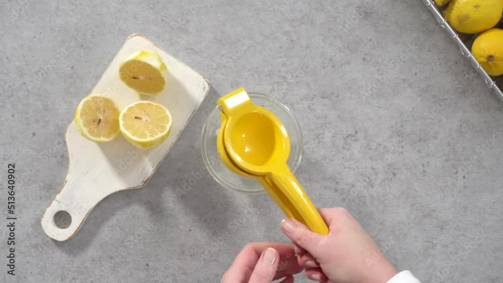 Time lapse. Flat lay. Step by step. Squeezing fresh lemons for baking lemon cranberry bundt cake.