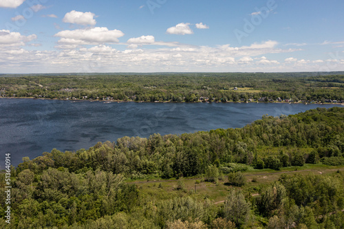 Fototapeta Naklejka Na Ścianę i Meble -  Port McNicoll drone panorama shot Northern central Ontario  blue skies blue lakes with clouds 