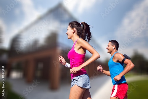 People sport running concept. Happy runner couple exercising outside as part of healthy lifestyle.