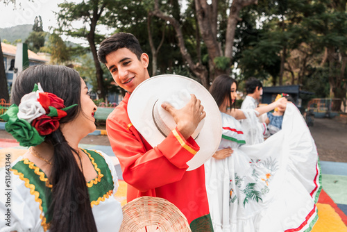 Group of Latin teenagers wearing the classic costume of dances from the north of NIcaragua in a Park of Jinotega photo