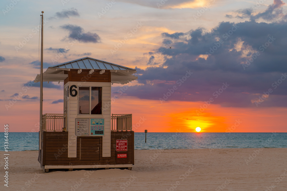 Clearwater Beach Florida. Beautiful Sunset. Beach lifeguard station or tower. Panorama of Clearwater Beach FL. Summer vacations in Florida. American Coast or shore Gulf of Mexico. 