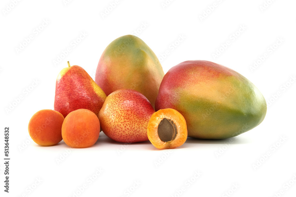 Whole and halved ripe apricot, pear and mango fruit Whole and halved ripe apricot, pear and mango fruit