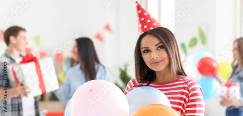 Pretty young woman with bal...