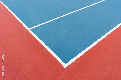 New blue tennis courts with white lines and red out of play area. 