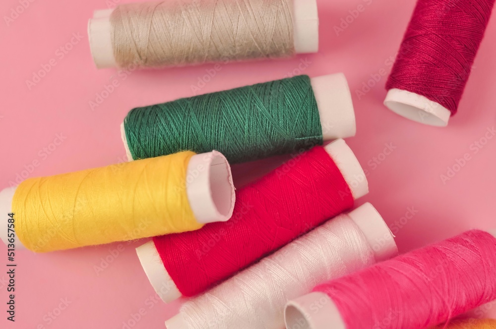 Equipment for sewing on pink background copy space Equipment for sewing on pink background copy space