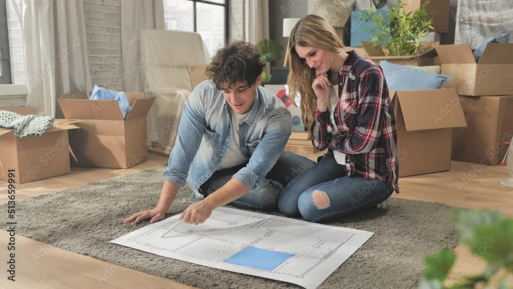 new house project couple planning renovation of the new home on blueprint layout,young people plan to renew the apartment,rent purchase mortgage concept