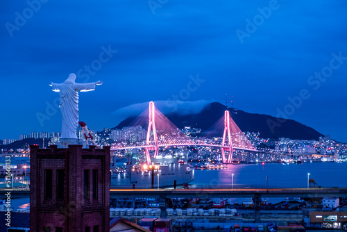 Scenic views of a bridge and mountains against sky during sunset photo