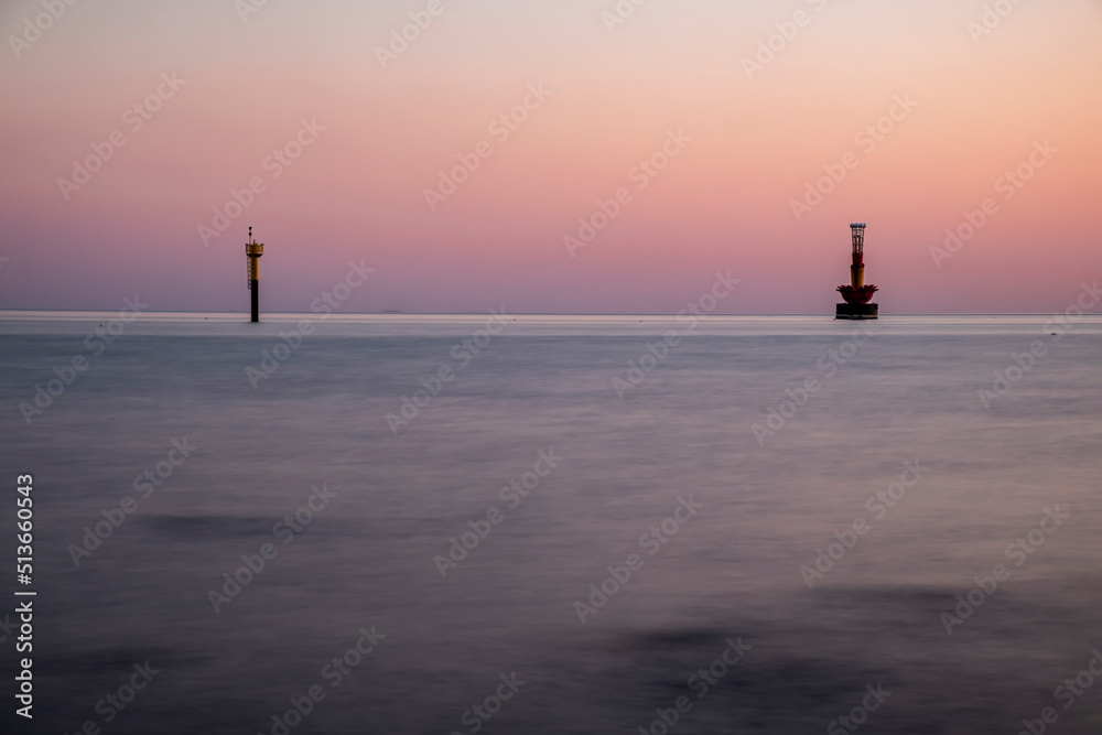 Scenic view of a harbor against sky during sunset