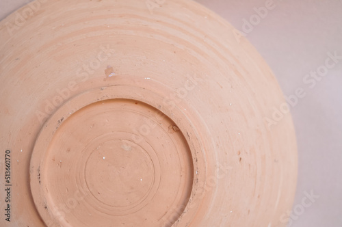 Close up of round earthenware bottom copy space