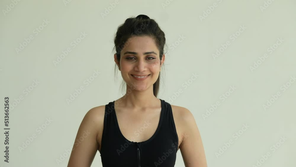 Portrait of beautiful young Indian woman face to camera and smiling Close up.Asian girl looking at camera with smile after gym. Portrait of beautiful young Indian woman face to camera and smiling Close up.Asian girl looking at camera with smile after gym.