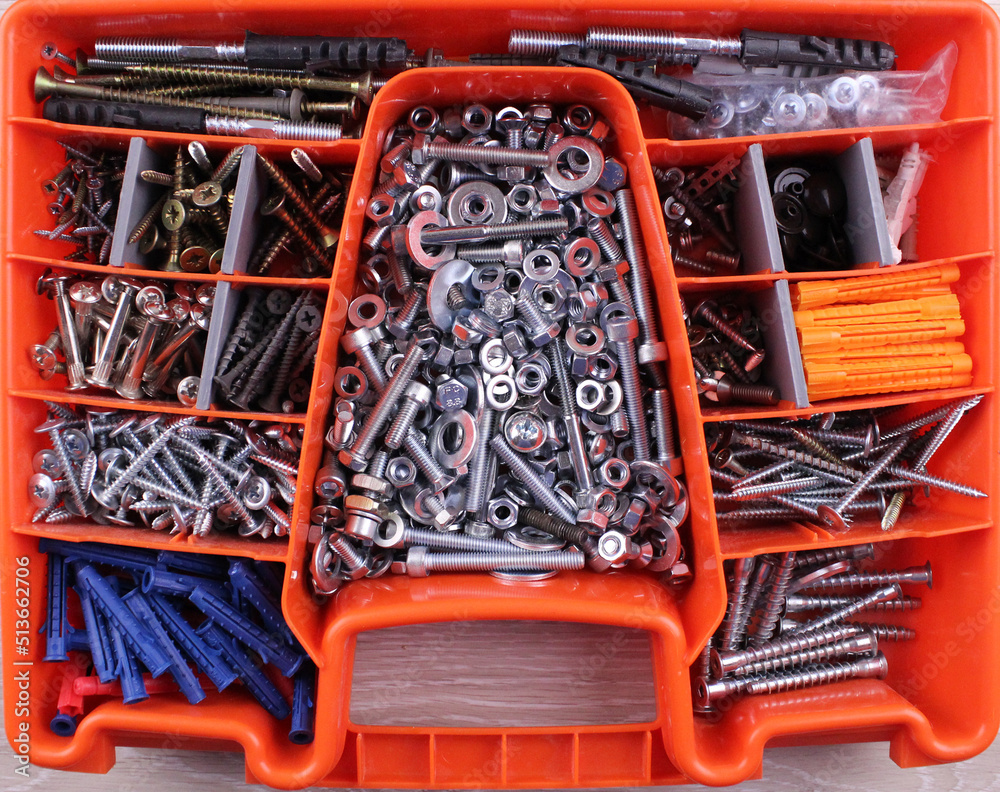 Various metal nuts, bolts and washers in a special box