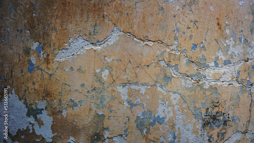 The texture of an old white wall with cracks.