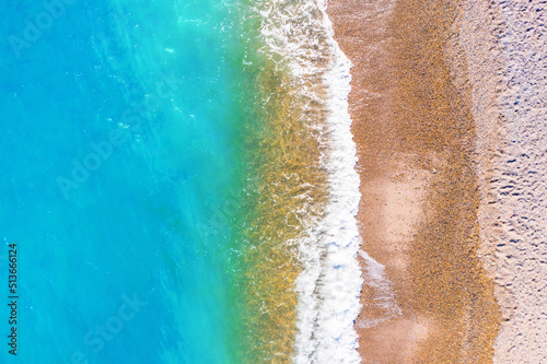 Coast as a background from top view. Turquoise water background from top view. Summer seascape from air.