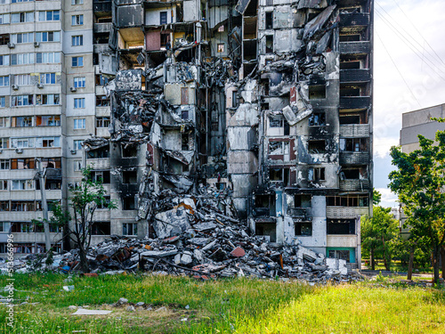 Destroyed and burned apartments in a multi-storey residential building. Residential area Saltovka. War in Ukraine.