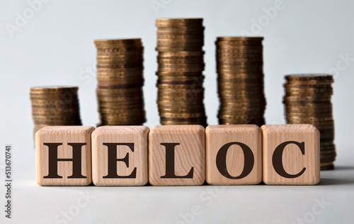 Wallpaper Mural HELOC - acronym on wooden cubes on the background of stacks of coins Torontodigital.ca