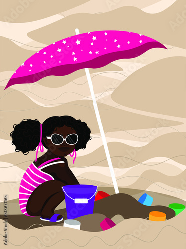 A child in a swimsuit and sunglasses plays in the sand under an umbrella.
