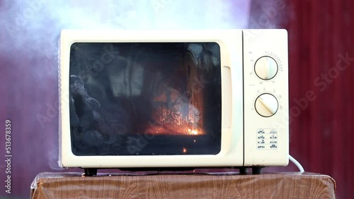 Ignition inside microwave oven due to malfunction or misuse.