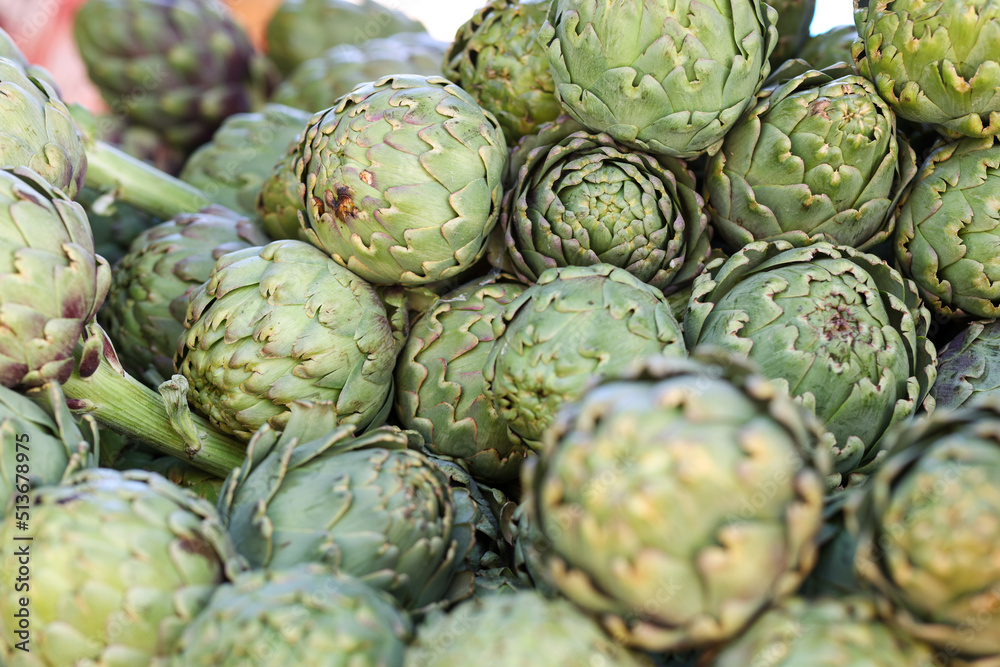 Fototapeta premium Bunch of artichokes at farmers market closeup