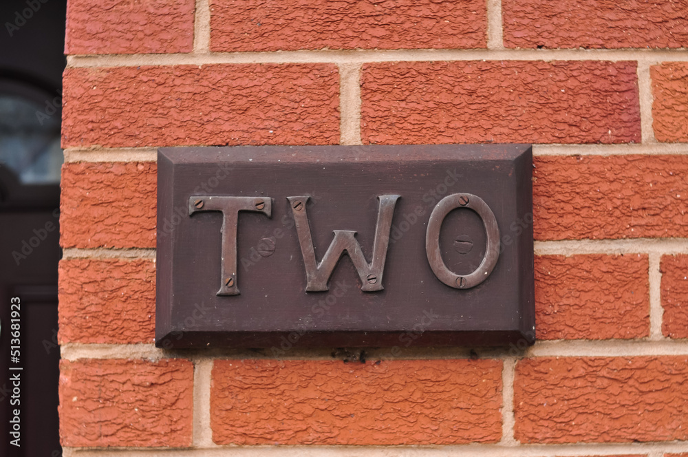 The word two on the red brick wall background . High quality photo The word two on the red brick wall background . High quality photo
