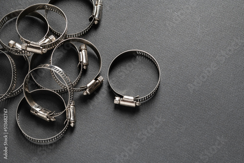 Tableau sur toile Metal hose clamp on black background. Empty space for text