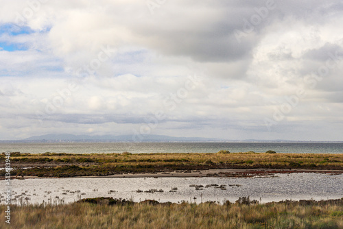 clouds over wetlands and the sea in western Melbourne