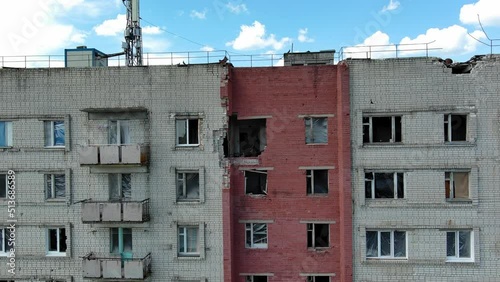 Chernihiv, Ukraine - June 27, 2022: War in Ukraine. Damaged ruined multi-storey house in ukrainian city Chernihiv near Kyiv on north of Ukraine. Ruins during War of Russia against Ukraine. photo