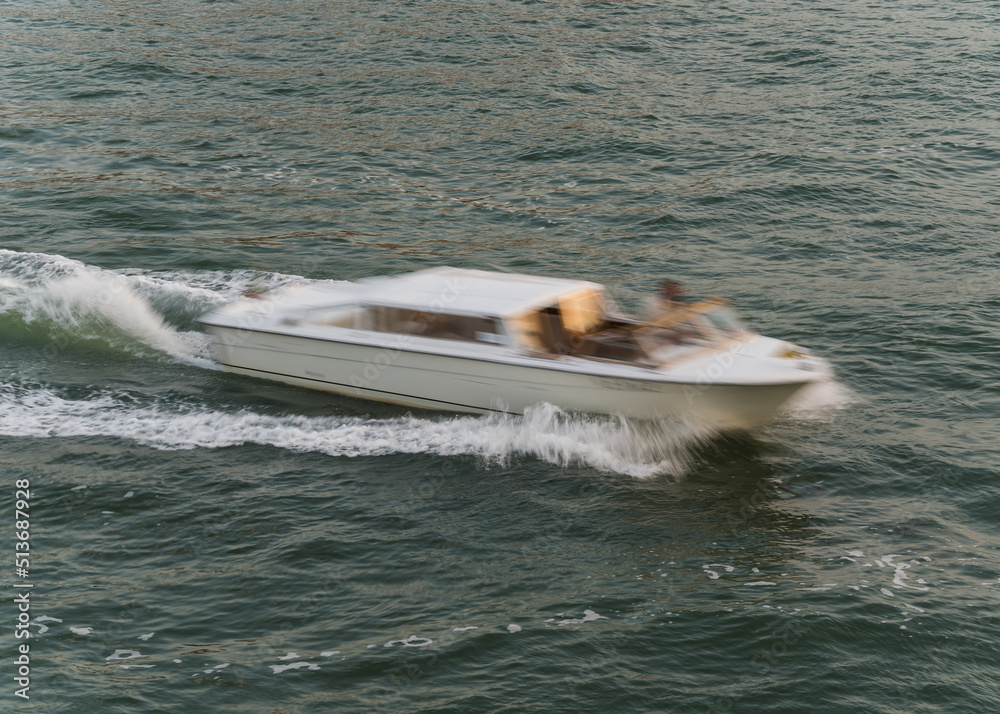 Fototapeta premium blurred photo of a boat navigating in the ocean 