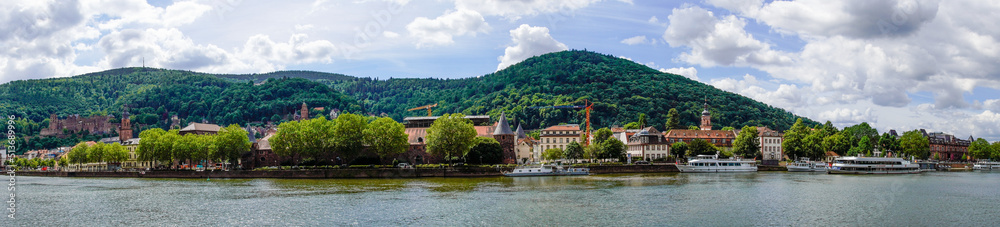 View of Heidelberg with the hilly landscape and the Neckar.
