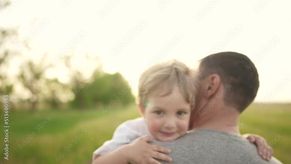 son hugging dad in the park. happy family a father day kid dream concept. baby baby boy walking with dad in nature in his arms. baby hugging dad in the park lifestyle son hugging dad in the park. happy family a father day kid dream concept. baby baby boy walking with dad in nature in his arms. baby hugging dad in the park lifestyle