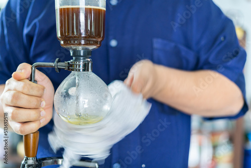 Making coffee with syphon method