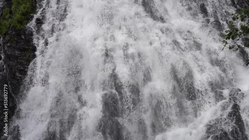 Hokkaido,Japan - June 22, 2022: Slow motion of stream at Oshinkoshin waterfall at Shiretoko, Hokkaido, Japan
 photo