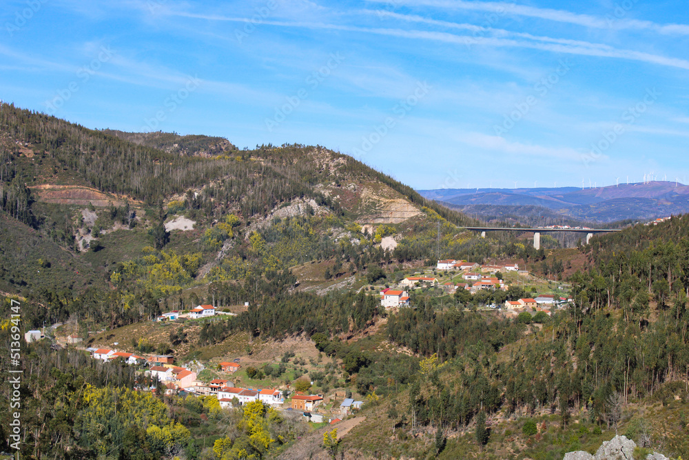 Landscape with hills with several houses.