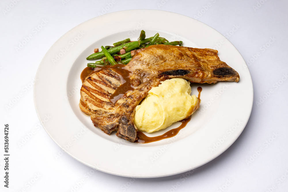 Chop on the bone with mashed potatoes Chop on the bone with mashed potatoes