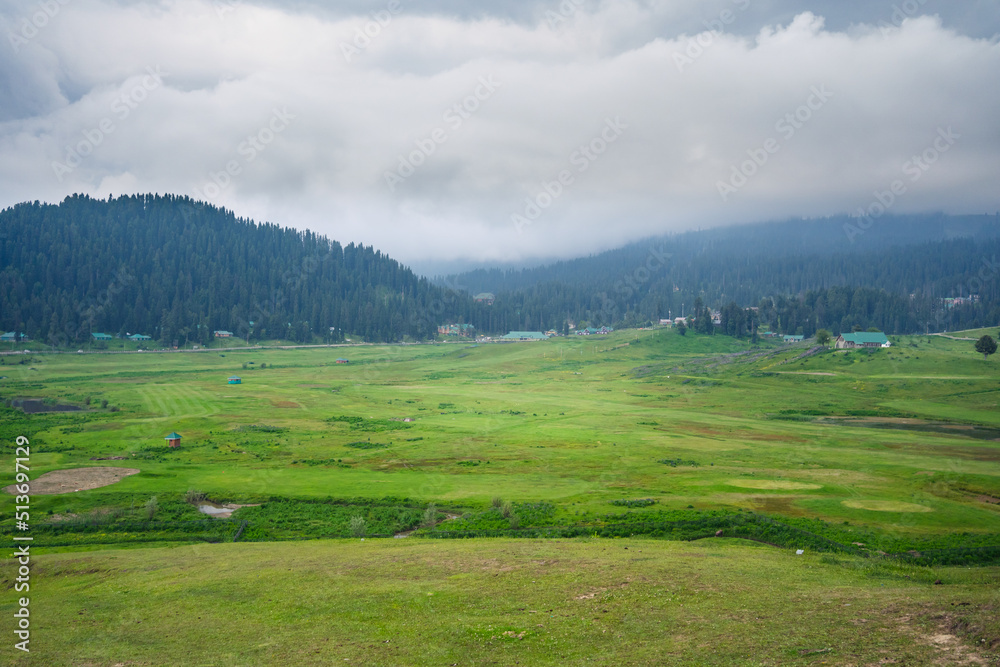Gulmarg, known as Gulmarag in Kashmiri, is a town, hill station, popular skiing destination, and notified area committee in the Baramulla district of Jammu and Kashmir, India.
