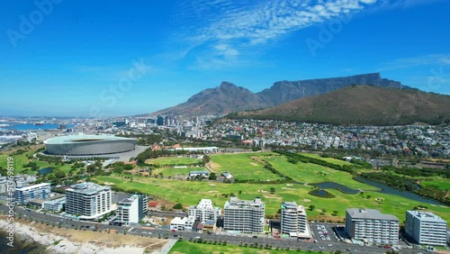 Sunny day in Green Point, Cape Town with coastline view of golf course and stadium, aerial