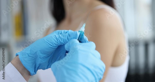 Doctor with syringe and refusal to vaccinate