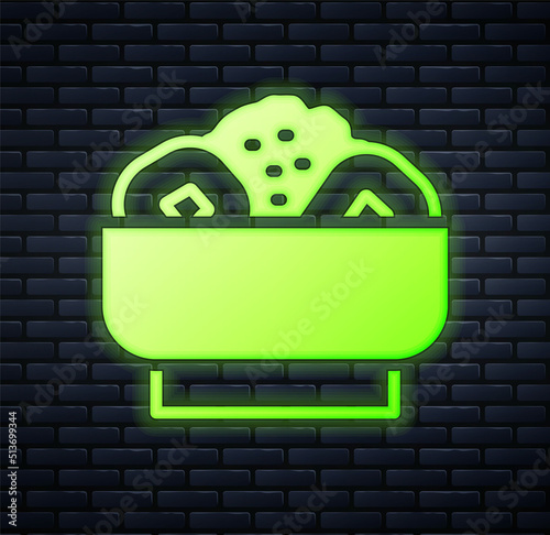 Glowing neon Chow mein on plate icon isolated on brick wall background. Asian food. Vector