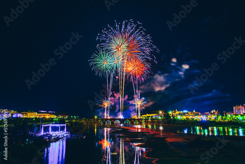 Fireworks over a park in the night sky, happy new year, year 2022-2023 © Pablo