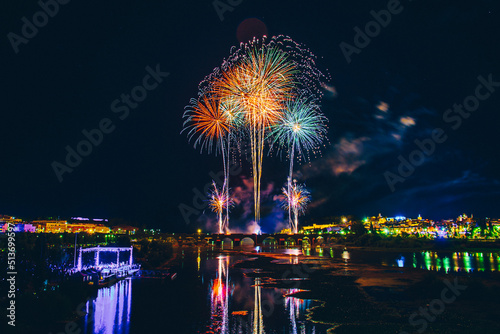 Fireworks over a park in the night sky, happy new year, year 2022-2023 © Pablo