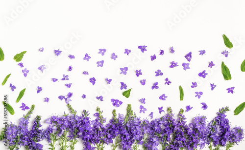 Composition of purple meadow flowers. The concept of summer, spring, holiday. Top view, flat lay.