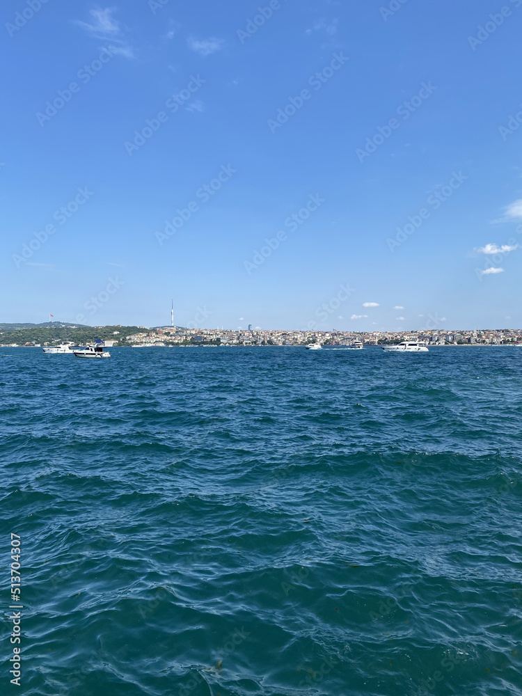 Bosphorus (Bosporus) tour in Istanbul. Turkish ships in the sea in summer concept. Travelling concept. Istanbul bosphorus view. View of fishing boats in the port.