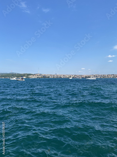 Bosphorus (Bosporus) tour in Istanbul. Turkish ships in the sea in summer concept. Travelling concept. Istanbul bosphorus view. View of fishing boats in the port. © Malvina