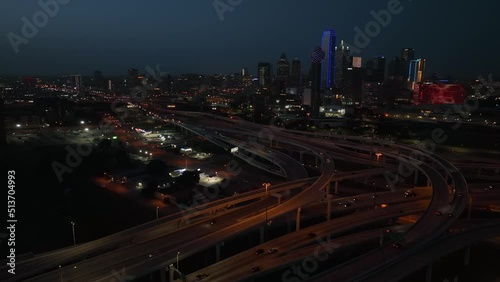 Interstate highway traffic at night in American metropolis. Aerial in evening light. photo