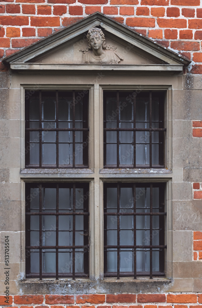 Barred window from a renaissance building or castle prison.