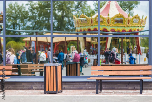 Benches for recreation and a garbage container in the Omsk amusement Park.