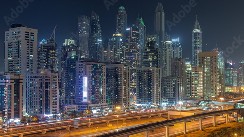 Dubai marina tallest block of skyscrapers night timelapse.