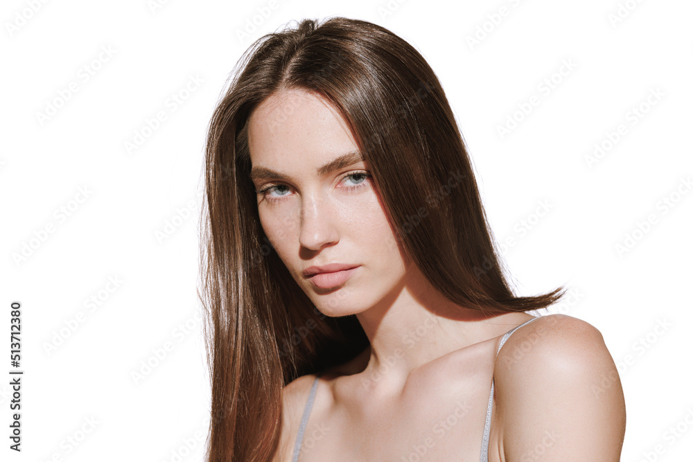 Portrait of beautiful young woman with glossy brown hair posing isolated over white studio background. Hair dying, care Portrait of beautiful young woman with glossy brown hair posing isolated over white studio background. Hair dying, care