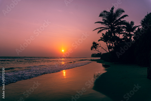 Male model walking on tropical beach at sunset  beautiful holiday landscape.
