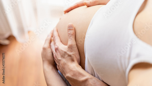 Belly hands pregnant woman. Happy pregnancy woman and husband hugging pregnant belly. Concept of pregnancy, maternity, expectation for baby birth.