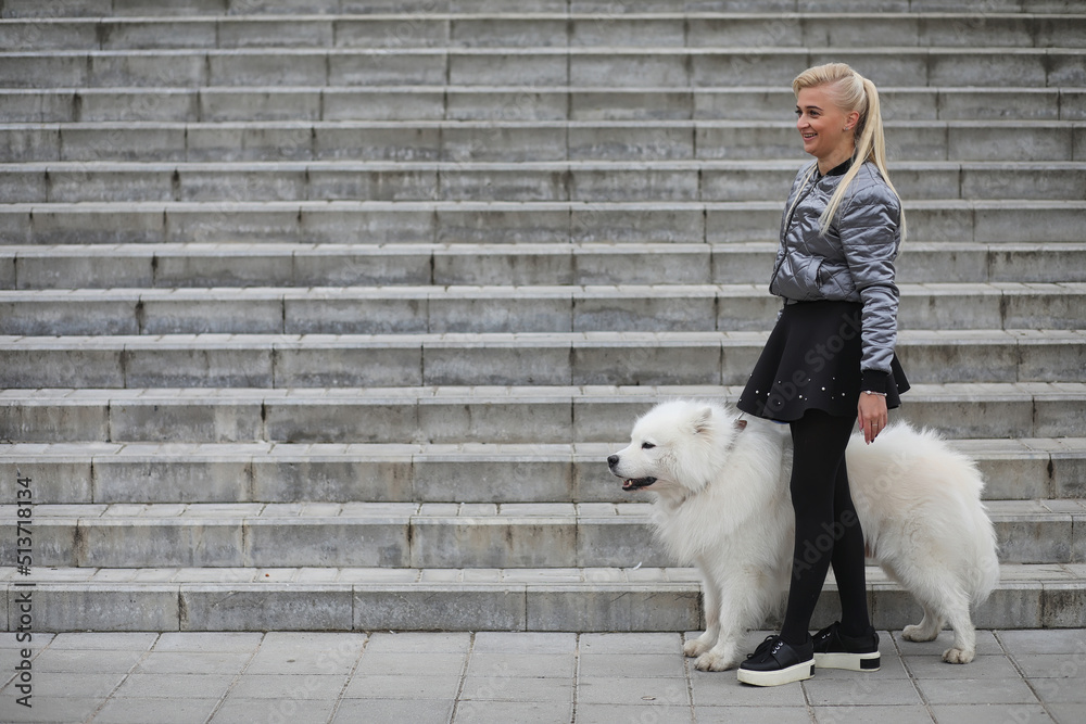 Lovely girl on a walk with a beautiful dog Lovely girl on a walk with a beautiful dog